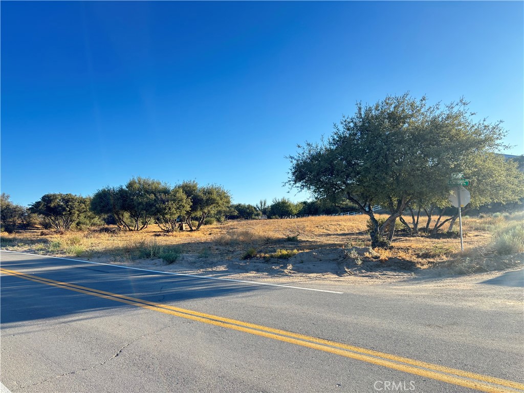 Don't miss this rare opportunity to own a 1.99-acre corner lot in the highly sought-after East Oak Hills community. Located on paved roads and surrounded by custom homes, this property offers plenty of space to build your dream home with room to spare for your RV, off-road toys, and more. Enjoy wide open skies, peaceful surroundings, and easy access to the 15 Freeway for a quick commute. Utilities nearby. Whether you're ready to build now or invest for the future, this lot offers the space and location you've been looking for! Seller may finance with substantial down payment.