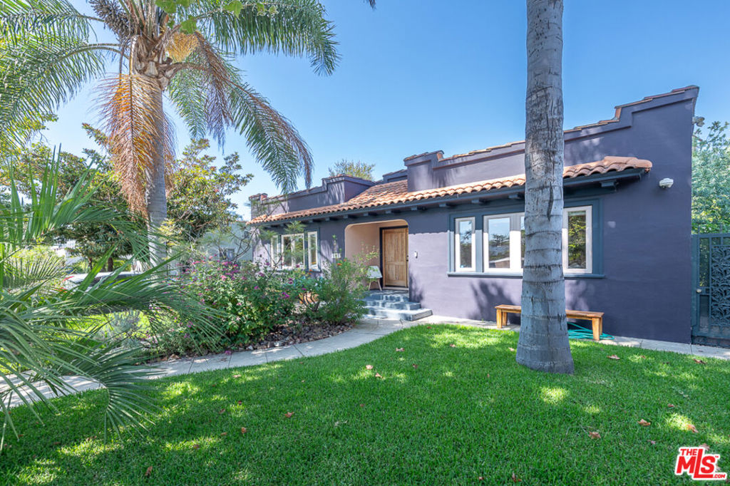 All reasonable offers reviewed on Thursday, August 14th at 12 noon. 5 Bed | 3 Bath | Detached Studio - Romantic Spanish Retreat in the Heart of West Hollywood. Tucked away on a quiet, tree-lined street in one of West Hollywood's most coveted neighborhoods, this exquisitely restored 1920s Spanish residence is a rare fusion of timeless elegance and modern sophistication. Every corner of this sun-drenched home has been thoughtfully reimagined to honor its architectural roots while embracing the ease of contemporary living. A graceful, open floor plan invites natural light to dance across wide-plank hardwood floors, leading you through arched passageways and into a stunning chef's kitchen outfitted with stainless steel appliances, a generous eat-in peninsula, and curated finishes that echo the home's historic soul. The flexible 4-bedroom, 3-bath layout features a secluded guest suite with its own entrance and kitchenette, ideal for extended stays, creative living, or generating passive income. A charming den with a second kitchenette offers additional versatility for work, play, or hosting.Outside, lush, drought-conscious gardens surround the home, providing privacy. Two bedrooms open directly to this tranquil oasis, where alfresco living comes alive with a built-in outdoor kitchen, BBQ, and gathering spaces beneath mature trees. A detached 256 sq ft artist studio with full HVAC and sliding glass doors to the garden completes this West Hollywood sanctuaryperfect for creatives, remote work, or quiet retreat. Located just steps from Plummer Park and the city's best shopping, dining, and culture, this extraordinary property offers a lifestyle of beauty, and serenity