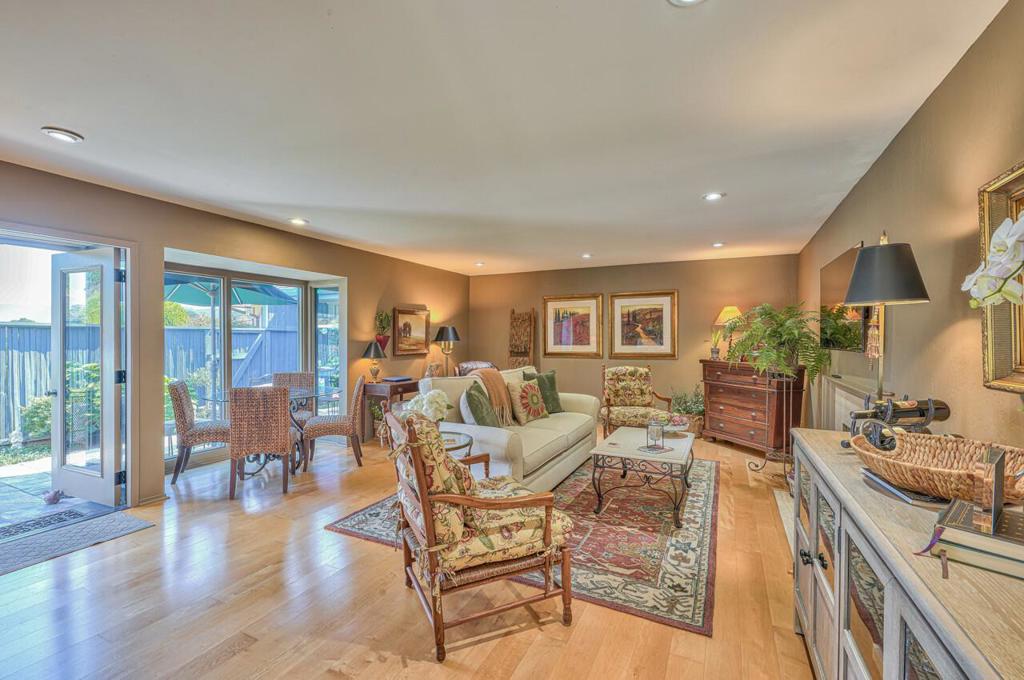 This 1 bed, 1 bath, D model floor plan brings in great natural light with its open and airy floor plan. Attention to detail throughout and meticulously maintained, this unit features newer stainless appliances, wood floors with radiant floor heat, beautiful fireplace, recessed lighting, office space and a beautifully landscaped private backyard. The large bedroom features multiple closets, all with great storage space, and the bathroom has an oversized walk in shower. This superior senior community in Carmel provides exceptional amenities, including indoor pool and spa, fitness center, lawn bowling, club house, putting green, garden plots, walking trails and guest rooms for friends and family. Your HOA monthly due covers a multitude of services and essentially your only other expense is internet, homeowner insurance and property taxes. Don't miss this one!