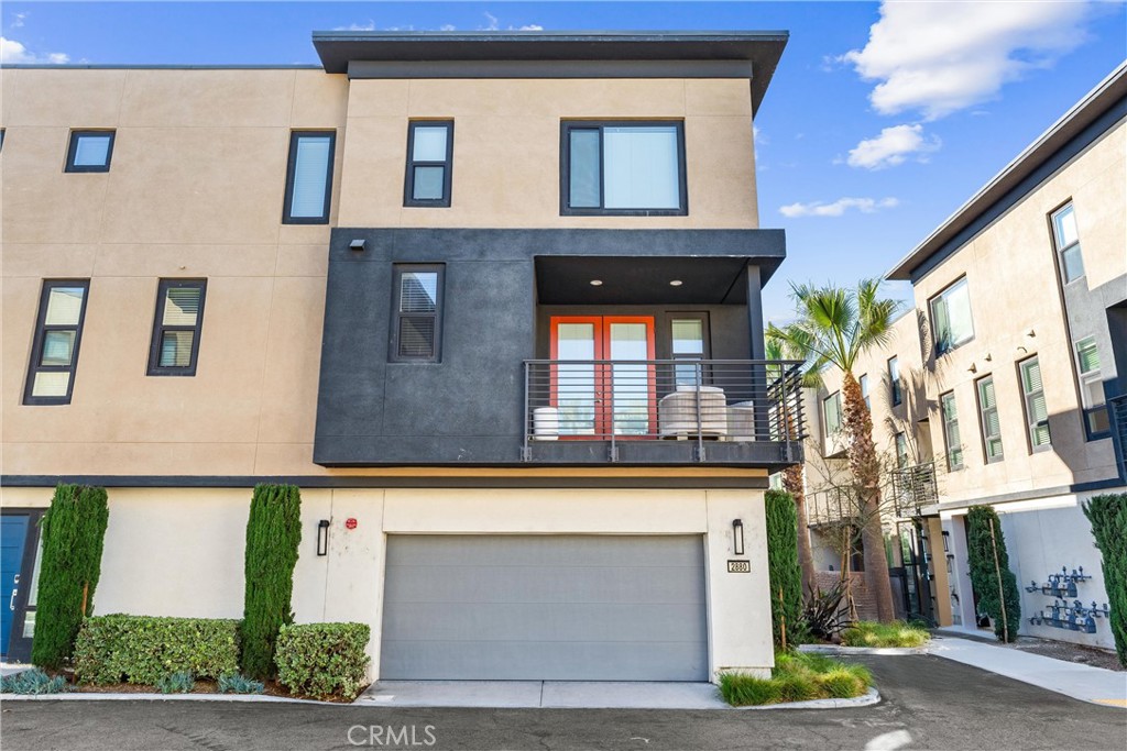 Welcome to 2880 N Glassell St, Orange, CA—a bright and modern end-unit townhome built in 2020, offering the perfect mix of contemporary design, smart layout, and unbeatable location. This thoughtfully designed 2 bed, 2.5 bath home features an open-concept floor plan, high ceilings, and abundant natural light throughout. The first level offers direct access from your 2-car attached garage, making daily life convenient and secure. Head up to the main living area on the second floor, where you’ll find a gourmet kitchen with quartz countertops, stainless steel appliances, and modern flat panel cabinets that flows into the dining and living spaces—perfect for entertaining. A private balcony, in-unit laundry, and a stylish half bath complete this level. The third floor features the primary ensuite, secondary bedroom, and full hallway bath. The home comes fully equipped with washer, dryer, refrigerator, and Culligan water softener system. It is located in a well-maintained, newer community with easy access to the best of Orange. Moments from Old Towne Orange and its antique shops, breweries, and brunch spots. Close to Chapman University, The Outlets at Orange, Angel Stadium, and Honda Center. Surrounded by scenic parks and trails like Irvine Regional Park and Santiago Oak. Plus, enjoy an easy commute with quick access to the 91, 55, and 57 freeways, getting you anywhere in OC or LA with ease. Whether you're a first-time buyer, investor, or looking for a lock-and-leave lifestyle, 2880 N Glassell is the total package.