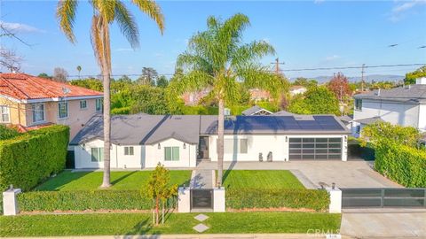 Photo of 9145 Raviller Drive, Downey, CA 90240 (MLS # DW26017733)