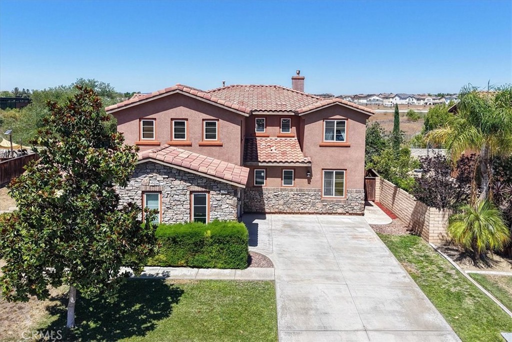 This spacious home features an oversized backyard. PERFECT for a future pool and play area and backs to a greenbelt for added privacy. The open-concept layout includes a large eat-in kitchen with granite countertops, stainless steel appliances, and direct flow into the cozy family room with a gas fireplace. Downstairs offers a private bedroom and full bath, a formal dining room, and a den/office with French doors opening to a charming courtyard—ideal for working from home. Upstairs, the expansive primary suite includes his-and-her closets and a luxurious five-piece bathroom with a jetted tub. You’ll also find a large bonus room, three additional bedrooms, and two full bathrooms. Recent upgrades include new carpet, fresh interior paint, and updated bathroom fixtures. The generous side yard adds extra space between homes. You do not want to miss out on this one. Priced to sell....