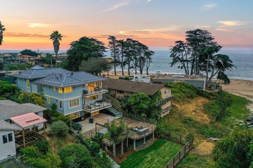 New Price!  Welcome home to your beautiful Beach House!  Rare find, unique Ocean Front home behind the gates on 14th avenue.  Private and sheltered from storms and yet, walk out your door for easy access to one of the best beaches in Santa Cruz.  This is an exceptional home with high-end construction built with concrete formed walls, brand new metal roof, radiant heating, elevator, hard wood floors, Carrera marble, granite, etched glass from local artist Heather Glass, built in bedroom sets, wine cellar room, wet bar, 1,000 sq ft indoor media/rec room with second kitchen prep & play area.  Several decks with breathtaking views and a huge back deck area with hot tub, fire pit and full bbq kitchen with granite counters for amazing hours of fun and entertainment.