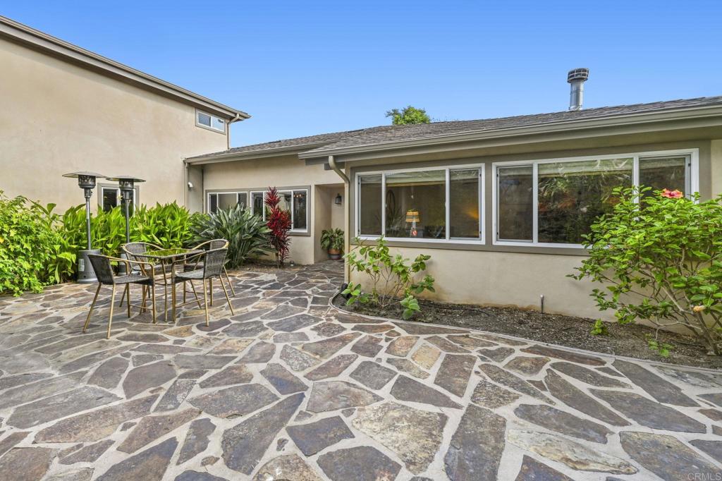 This is a stunning fully gated INCOME PRODUCING property. The main house is 4 bed 2 bath ranch style home with wood floors, granite countertops, wood burning fireplace, new roof, new plumbing, epoxy lined drains, new insulation gorgeous landscaping, BBQ island, sundeck with palapa, fire pit, custom concrete garden beds, fruit trees, & attached 2 car garage. Both ADUs have wood floors, quartz countertops, stainless steel appliances, & full size washer/dryers. Property has an additional detached 2 car garage that is currently rented by the tenant above. Both ADUs are 1 bedrooms. Property is being sold with tenants in place. Total income from the ADUs and detached garage is $5200/mo. Property has room for RV parking with sewer hookup. Property is being shown by APPT ONLY. First showings will be 9/20.