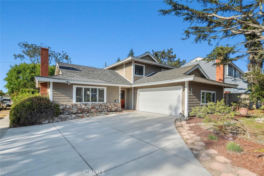 Located in a sought-after South Redondo neighborhood with no through traffic, this charming two-story home sits just steps from Alta Vista Elementary School and Park, and minutes from the beach, bike path, and Riviera Village. Offering 4 bedrooms and 2 baths across 1,744 sq. ft. of living space, the home is situated on a generous 6,403 sq. ft. corner lot. The functional floor plan features two bedrooms on the entry level and two upstairs, with new vinyl flooring throughout. The entry-level bathroom has been fully remodeled, while the upstairs bath has been updated. The bright and sunny living room flows into a spacious dining area and a kitchen that opens to the backyard—perfect for everyday living and entertaining. The kitchen is equipped with stainless steel appliances, including a double oven, dishwasher, microwave, and refrigerator, plus a breakfast bar and recessed lighting. An attached two-car garage includes laundry and direct entry. Both the front and backyards offer generous space, with the backyard featuring a patio and gated access for potential boat or RV parking.