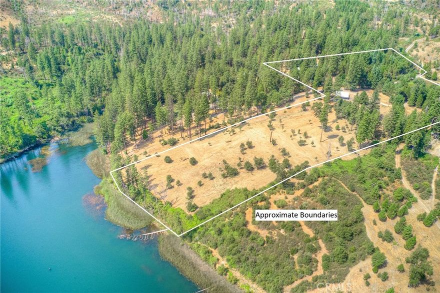 Stunning 15 Acre horse ranch on Lake Concow.  This unique property is cross fenced for horses and farm animals.  Two incredible metal horse barns provide ample fully covered stalls, hay/feed storage and an entire office for tact and all your animals’ necessary needs.  One Barn is fully enclosed protecting everything inside from weather and includes an office, workshop area, multiple stalls and turnout pins.  Located behind this barn, is an additional, third large metal storage barn for all your farm-related equipment.  The stunning horse training arena is meticulously leveled with care and built for horse training and riding!  The property is fully accessible with redwood tree lined trails, fenced garden areas, detached horse stalls in the pastures and boasts natural water shed with a lush, seasonal creek.  The trustee recently had the five acres resting on Lake Concow masticated and mulched providing stunning access and views of the nearly 400 feet of shoreline to Lake Concow.  This is a great spot to build a custom second home, and would provide stunning views of the lake, sunsets and nature.  



Three parcels make up the 15 acres total and are being sold together, providing one of the most stunning privately owned ranches in the area.  The 2-bedroom, 2 bathroom manufactured home has had many updates over the years to include the primary bathroom and kitchen along with flooring throughout.  Recently the entire home was painted inside!  There is a attached carport providing access directly into the home.  The front of the home has a fully enclosed sun porch to enjoy the beautiful surroundings!  There are SEVERAL wells on the property, owned SOLAR and a Generac generator.  This is a rare opportunity to purchase nearly unscathed property in Concow.  The tree canopy is matured, groomed and ready for you to enjoy all the mountain ranch life, with lake front property!  Call your Realtor today to schedule a private tour.