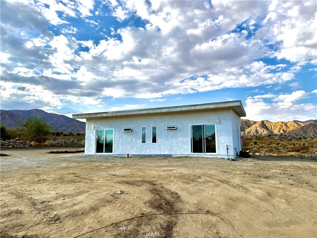 Experience the perfect blend of modern living and natural beauty with this newly constructed 1,600 sq. ft. smart home, ideally set on a spacious 1.75-acre lot in the tranquil High Desert near Joshua Tree. Currently receiving its finishing touches and nearly ready for a Certificate of Occupancy, this home offers a rare opportunity to own a premium desert retreat.
Thoughtfully designed for comfort, sustainability, and style, the home features two primary bedrooms, polished concrete floors throughout, and a bright open-concept living space with quartz countertops and stainless steel appliances. Climate control is made easy with individual mini-split heating and air units with ceiling cassettes, while paid solar and a car charging port ensure eco-friendly living.
Enjoy breathtaking desert views from the expansive lot, with plenty of room to create your outdoor sanctuary. A storage shed is included for added convenience.
Whether as a full-time residence, vacation home, or investment property, this new build is the perfect blend of modern technology and desert serenity.
