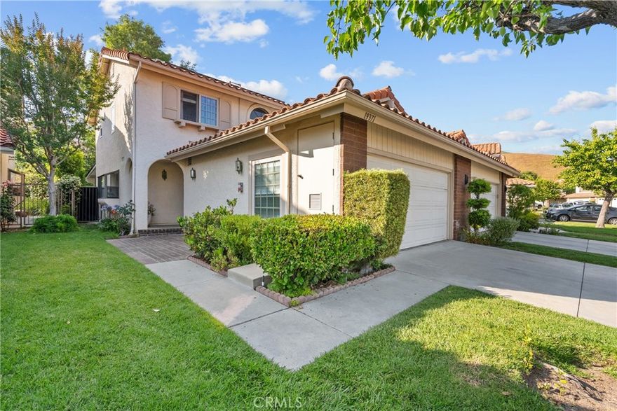 A rare residence nestled in the gated community of Porter Ranch Estates—where luxury living meets smart, energy-efficiency. This stunning home offers the perfect blend of comfort, privacy, and long-term savings with completely paid-off solar panels making your power bills lower than ever before. From the moment you arrive, you're greeted by pristine curb appeal and a welcoming entry that sets the tone for the sophisticated living experience inside. Step into a bright and spacious floor plan, expansive living areas, and tasteful finishes throughout. The gourmet kitchen is an entertainer’s dream, featuring sleek countertops, premium cabinetry, and ample space to host unforgettable gathering. Retreat to the  primary suite, complete with a spa-inspired bathroom, dual vanities, a soaking tub, and a large walk-in closet. Additional bedroom includes plenty of space for family, guests, or a home office. The living room with fireplace creates the perfect ambiance for cozy nights in. Kasa Smart Switches allows you to have full control of your lights all from your smart phone. Outside, your oversized private backyard offers a tranquil escape with plenty of space to entertain, relax, or garden—all while utilizing the Ranchio Smart Sprinkler System throughout the backyard having full control from your smart phone. Located in one of Porter Ranch’s most desirable communities, you're just minutes from top-rated schools like Castle Bay Charter, parks, hiking trails, The Vineyards Shopping Center, and easy freeway access. This move-in ready smart gem is more than just a home for a family but a lifestyle with a community park, new playground, tennis courts, volleyball courts, basket ball courts and with two pools/jacuzzies all within walking distance. Don’t miss your chance to own a smart and stylish home with unbeatable value!