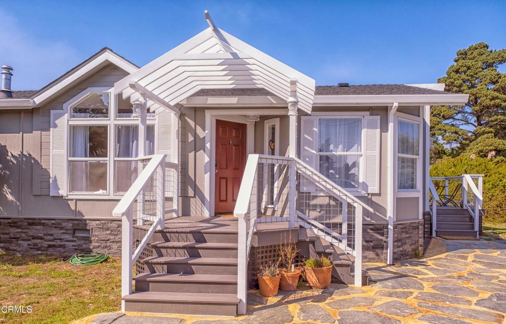 Find relaxation and joy in this turn-key home by the sea. Upon entering you are welcomed by an abundance of windows and high ceilings, making the space bright and open. An attractive gas fireplace adds to the ambiance. The kitchen boasts quartz countertops, a farmhouse sink overlooking the spacious backyard, and quality Blomberg appliances. The layout of the 3 bedrooms and 2 baths is simple and functional, with a bonus laundry room off the kitchen. The primary bath has an inviting corner soaking tub surrounded by windows. The outdoor spaces are absolutely lovely. A covered porch with an ocean view peak opens up to the back yard and fire pit area. The hot tub invites relaxation under the stars. With 1.23+/- level acres, there is plenty of room for your garden and landscaping dreams to come to life. Pleasantly located less than half a mile to the Mendocino Coast Botanical Gardens and even closer to Hare Creek Beach. Fort Bragg is just over the bridge with small-town dining, shopping and more. Currently a booked-out vacation rental, this could be a turn-key business or your own private pacific coast getaway.