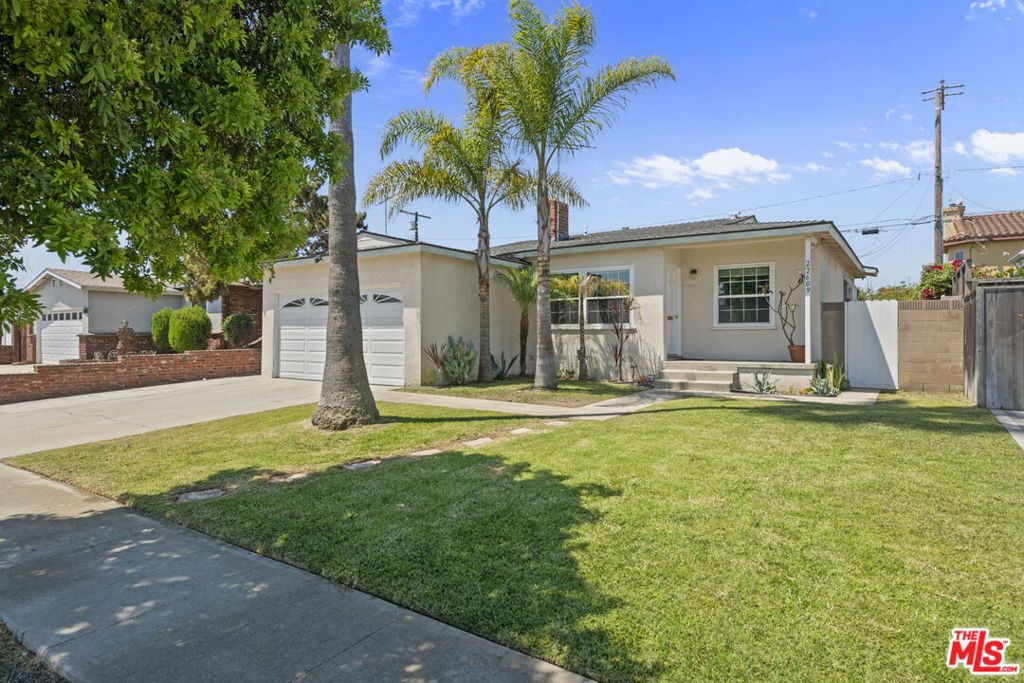 Charming three-bedroom bungalow just a few miles from the beach on a quiet street in Torrance's Southwood Riviera. The inviting interior features a cozy living room with a large picture window and decorative brick fireplace, a dining area, and a bright kitchen with wood cabinetry, tile countertops, a bar area, and a breakfast nook. Bedrooms offer ample closet space, and the updated bath includes a tub with a tiled shower. The spacious backyard is ideal for dining, entertaining, or simply relaxing, with potential to create your perfect indoor/outdoor lifestyle. Move-in ready with vintage charm and room to customize to your personal needs.