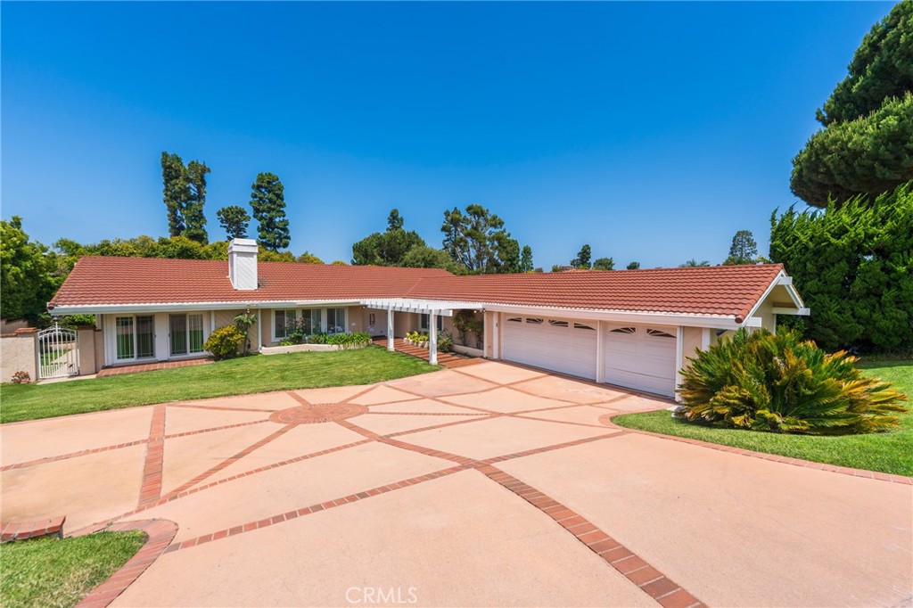 Welcome to 30243 Avenida Selecta in Rancho Palos Verdes. Located on a cul-de-sac, this spacious single-level home offers vaulted ceilings, abundant natural light, and two fireplaces that enhance the inviting interior. The layout includes multiple living and dining areas, perfect for everyday living and entertaining.
Step outside to a private backyard featuring a sparkling pool and spa, surrounded by mature landscaping, ideal for outdoor enjoyment. The expansive driveway and attached three-car garage provide ample parking and storage.
Situated near award-winning Palos Verdes schools, scenic coastal trails, golf courses, and shopping, this home offers the best of comfort, location, and lifestyle.