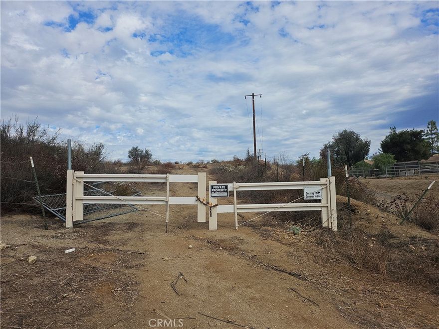This 9.92 acre parcel of land is on a well maintained private road for easy access, it is slightly elevated to give you terrific scenic views of the surrounding community.  With multiple pad locations and zoning, you can potentially build two homes and two ADU's after obtaining an approved lot split.  Please check with the city or county planning departments to inquire on the process for obtaining a lot split and any building requirements.  Electricity is in the street and a well and septic system will need to be installed.
