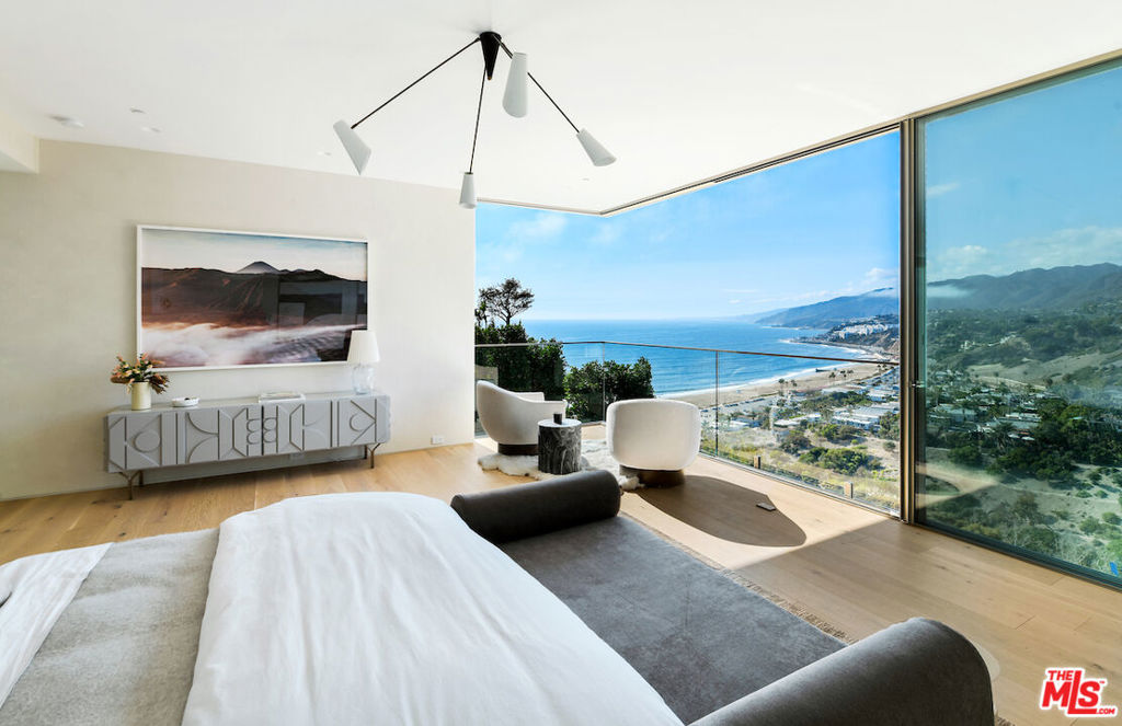 Situated on the bluff with panoramic views of the mountains and ocean, and just a short stroll to Palisades Village -- this property truly encompasses luxury coastal living at its finest! This exceptional new construction located in the highly coveted Palisades Via Bluffs boasts incredible ocean views and impeccable modern design. The spacious floorplan includes 5 bedrooms and 5.5 baths with an office space. This property was custom designed and built by the renowned building and design team, David and Eliana Rokach. Property highlights include an infinity edge pool, full basement level with natural light, and a large rooftop deck with hot tub. Top-of-the-line design and craftsmanship are evident in every detail of this stunning home.