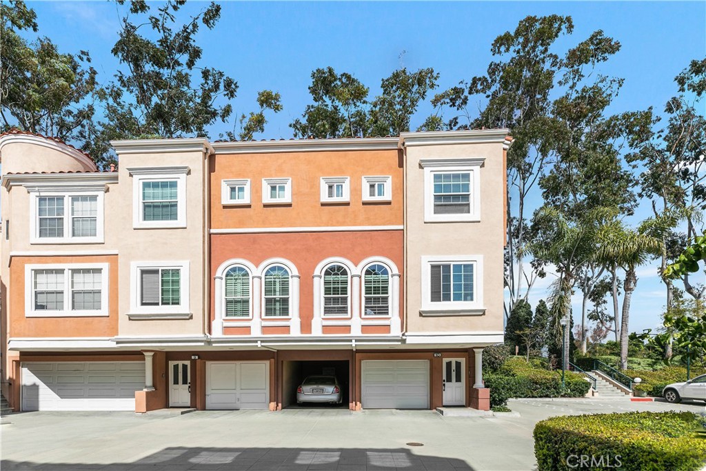 Magnificent and pristine 1 bedroom plus loft (loft could be used as a bedroom, office, or den) beautifully upgraded townhouse in the desirable Corte Bella community of Westpark, Irvine! Light, bright, and open with high ceilings throughout. This private end unit has no one above, below, or behind. Cooking is a joy in the cheerful kitchen with its craftsman style white cabinetry, quartz counter tops, glass tile backsplash, stainless steel appliances, and farmhouse sink. Spacious living and dining great room has fabulous windows with 5” plantation shutters and abundant natural lighting, plus a cozy fireplace with gas logs and travertine tile surround. Gorgeous forged hickory real wood flooring throughout the home. Tile in bathrooms, with no carpet in the home. Generous size master bedroom has vaulted ceiling and mirrored wardrobe. Luxuriate in the spa-like master bathroom, which has lovely cabinetry, quartz counter tops, freestanding soaker tub, and separate shower with glass enclosure and floor to ceiling custom tiles. Other features include newer windows throughout, French door to private rear patio – perfect for dining and delightful summer evenings, serene paint tones throughout, mirrored closet in loft, travertine floor entry, one car attached direct-access garage, and Ring video doorbell. Resort-style community association amenities include pool, spa/hot tub, barbeque, gated entrance, splendid landscaping and trees, and European architecture, fountains, and statues. Next to wonderful Remo and Bill Barber Parks, and close to shopping, dining, entertainment and the San Diego Creek walking and bike trail. Refrigerator, clothing washer/dryer included. Come home to your beautiful life at 10 Crivelli Aisle, Irvine!