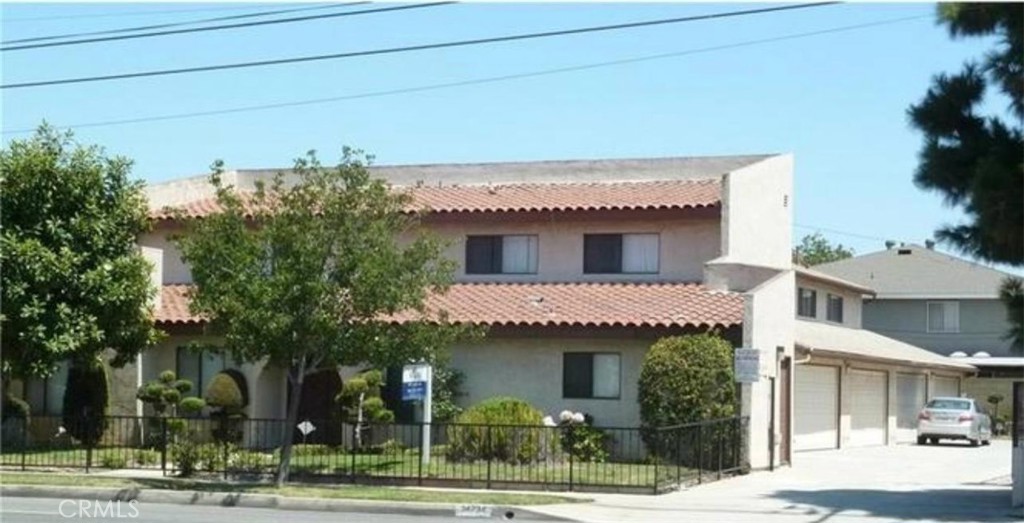 This beautiful two-level condo offers a modern and functional layout, perfect for those seeking comfort and style. It features 2 spacious bedrooms, 1.5 bathrooms, and a laundry area conveniently located on the second floor. The interior boasts high-gloss white ceramic tile flooring on the first level, adding brightness and a sense of spaciousness. Upstairs, wood flooring brings warmth and elegance to the bedrooms, which include large closets and blackout curtains for restful sleep. Enjoy a functional kitchen with a gas stove, range hood, compact refrigerator, and a clean design that opens to the living area. The fireplace in the living room adds a cozy touch, ideal for gatherings or relaxing at home. The unit includes a private two-car garage with direct access to the home, featuring a stylish RaceDeck red and black interlocking tile floor, plus an additional driveway parking space, providing parking for up to three vehicles. Additional features; Central air conditioning throughout, Private open patio, perfect for enjoying outdoor space and Artistically decorated bathroom sinks, offering a unique decorative touch located in a quiet, well-connected area of Gardena. This condo is a great opportunity for living or investing in Southern California.