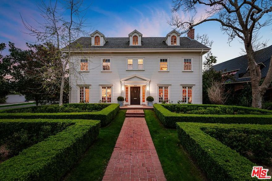 Light Filled Stately Traditional Colonial home in Windsor Square HPOZ. The house is situated in the 3rd Street Elementary School District and is located two blocks from Larchmont Village. Sits on a coveted street displaying luscious English-style gardens. Gracious and majestic, featuring high ceilings, large-scale rooms, original hardwood floors, and molding. The house exhibits a traditional floor plan with 4 spacious bedrooms plus an office/sunroom or a fifth bedroom and a balcony spanning the entire back of the house. A renovated kitchen with Viking appliances, Soapstone kitchen counters, and ample pantry space. Hotel-style laundry room equipped with walnut butcher block countertops and a double washer and dryer. The living room, dining room, and family rooms are flooded with natural light leading to the charming screened-in porch which looks out to the well-manicured backyard with a BBQ area. The backyard includes a saltwater pool with a cabana and a gas-burning fireplace. The additional third floor doubles as a bonus space/playroom/high-definition digital screening room. The two-car garage is detached with a pool bathroom, changing room, and generous room for storage. Come see this exclusive listing which embodies the ideal family home.