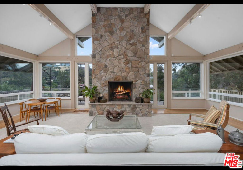 Welcome to the picturesque Malibou Lake Mountain Club! This captivating 3-bedroom, 3.5-bath home offers an expansive floor plan, generous living spaces, and a private dock for tranquil lakefront living. The beautifully designed open-concept living area creates an ideal space for gracious entertaining, featuring sleek stainless steel appliances, ample storage, and a bright, sunlit breakfast bar. The versatile bonus room with a full bath downstairs is perfect for gatherings, while the inviting upstairs bedrooms are flooded with natural light. The main floor primary suite includes spacious ensuite for ultimate comfort. Step out onto the large balcony and soak in stunning lake and mountain views. As a resident of the exclusive Malibou Lake Mountain Club, you'll enjoy access to resort-style amenities including a pool, tennis court, and more. Nestled in the heart of Agoura, this prime location offers convenient access to shopping, dining, and entertainment. Don't miss this incredible opportunity to call this remarkable home yours!