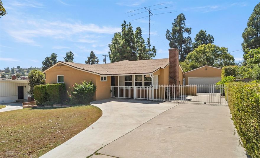 This charming single-level home in a quiet Midwick Tract neighborhood features a covered front porch and formal entry that open to a living room with a fireplace. Adjacent to the living room is a family room with two office alcoves behind louvered doors. The kitchen has been updated with a large quartz island providing seating and workspace. There are three bedrooms and two updated bathrooms, including a primary suite with its own bath. The backyard offers mature fruit trees and open space for relaxing or entertaining. A detached two-car garage with a workshop and an extra-long gated driveway provide ample parking. The home is close to Atlantic Times Square, restaurants, shopping, and public transportation, with convenient access to Downtown Los Angeles. Move-in ready!