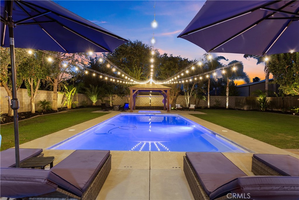 This stunning home is located in a serene neighborhood of northwest Bakersfield. Single story home that has 4 bedrooms, 2 bathrooms, a 3-car garage and is equipped with recently updated recessed lighting throughout the entire home. Enjoy a home on a lot that is spacious enough to accommodate RV parking and a large backyard that would be perfect for hosting with a covered patio, two fire pits, a private pool and spa. The interior of the home has high ceilings and is thoughtfully decorated with quartz countertops, elegant cabinets, spacious bathrooms, plus stainless steel appliances. The garage also includes epoxy flooring great for using as a home gym or personal workshop. Do not miss out on this beauty, contact the agent to setup your showing today!