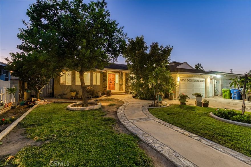 Large family home ready for you to make it your own! Floor plan is open and bright with the living room opening to the dining room and kitchen. There is a hidden family room with its own central AC system, gas fireplace, recessed lighting, plus it has its own entrance. The kitchen has granite counters and a large serving island surrounded by wood cabinets. The main bedroom is at the rear of the property and has 3 closets and a large private bathroom. Even with  a home this size, there is still plenty of yard space with the 8,000 square foot lot. There is plenty of parking in the driveway or in the 2 car garage. Home is very close to shopping centers and easy access to the freeways. Come see this home now and me amazed on how much space there is to enjoy.