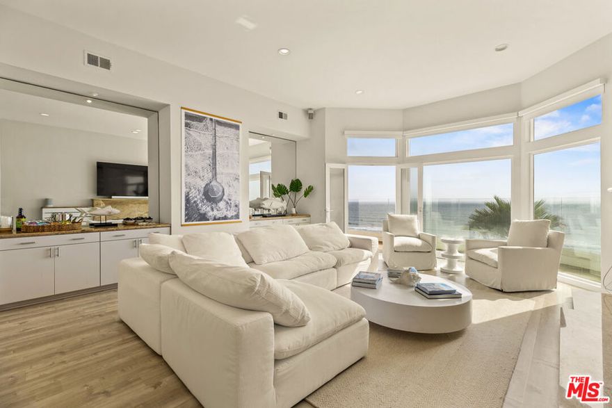 Nestled within the prestigious enclave of Manhattan Beach, this stunning oceanfront penthouse presents unparalleled panoramic views of the Pacific Ocean. Impressively furnished, this single-story condominium showcases a sophisticated sunken living room adorned with a plush Restoration Hardware Cloud sofa and a charming fireplace, providing an ideal retreat for relaxation. The residence features a spacious dining area accommodating 8 guests comfortably, complemented by an open-concept kitchen outfitted with high-end stainless steel appliances. The primary bedroom serves as a tranquil sanctuary, offering serene ocean vistas that provide a soothing backdrop of waves, ensuring a peaceful escape from the daily hustle and bustle. Additionally, there are three generously sized bedrooms, each equipped with motorized blackout shades for optimal privacy and comfort. Adding to the allure, the property includes a versatile den or game room complete with a second fireplace, infusing warmth and luxury. Convenience is paramount, with a practical laundry area conveniently located on the same level. Further elevating this exceptional residence is the provision of three secured parking spaces with direct access to the penthouse. More than just a residence, this penthouse represents a luxurious beachfront sanctuary, harmonizing natural beauty with upscale living in one of Manhattan Beach's most coveted locations.