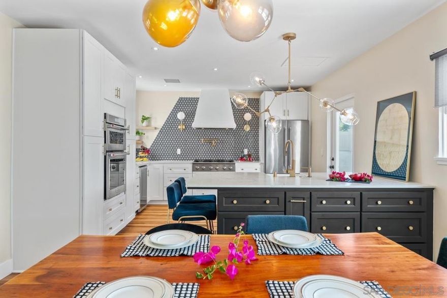 This is more than a property—it’s a smart investment with lifestyle perks baked in. Whether you’re a savvy house hacker ready to live in one unit and rent the rest, a multi-generational family craving space and privacy, or an investor eyeing the potential for more ADUs—this property checks every box.  Set on an expansive 7,000+ SF lot, this mini-compound boasts three separate residences, each with modern finishes, stylish furnishings, and ready-to-go rental potential.  The beautifully remodeled 2 bed / 1 bath main house showcases Spanish charm with a show-stopping central kitchen. The primary bedroom features a flexible bonus space—ideal for a walk-in closet, office, or nursery.  The attached JADU includes a full kitchen, bath, and ductless mini-split—perfect for guests, tenants, or short-term rental income.  Then there’s the detached 1 bed / 1 bath ADU, built from the ground up in 2019. With central AC, its own private yard, and architecture that tastefully mirrors the main house’s Spanish style, it offers both independence and aesthetic cohesion.  Extra perks? Leased solar at just $89/month, an EV charger hookup, and alley access—ideal for additional ADU expansion, extra parking, or creating separate entrances for tenants.  The large lot offers rare space in the city: plenty of room for a pool, spa, garden, or outdoor entertaining, all tucked behind a high privacy fence for your own urban oasis.  Located in the College Area, minutes from SDSU, North Park, and Downtown, this is your chance to own a versatile, income-generating property in a rapidly growing neighborhood.