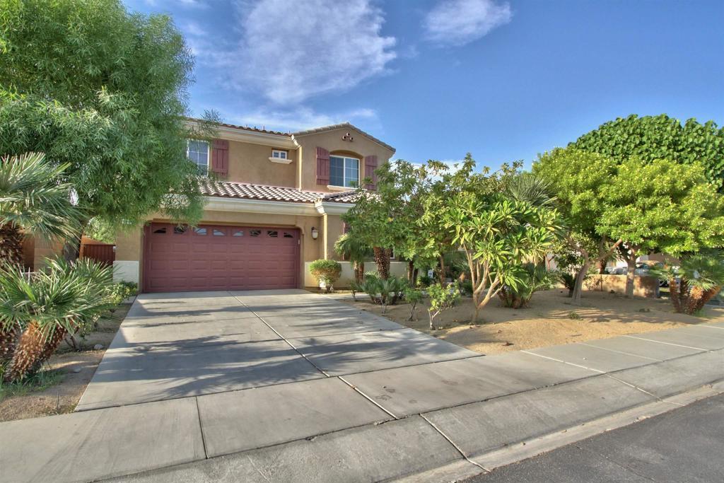 Welcome to one of the most expansive floor plans in the gated Prado community. The main floor features high ceilings, a family room with a fireplace, a large living room, and a modern kitchen equipped with granite countertops and a central island. There are also two large bedrooms downstairs, including one with an ensuite bathroom. The curved staircase leads to a loft area, four additional bedrooms and a laundry room. The primary bedroom is generously sized and includes its own balcony with mountain views. The fully enclosed yard contains various fruit trees, a firepit, a raised garden bed, and ample space for playing, relaxing, or entertaining. The attached two-car garage offers plenty of storage and has nice epoxy flooring. This beautiful house is very close to the Prado community park.