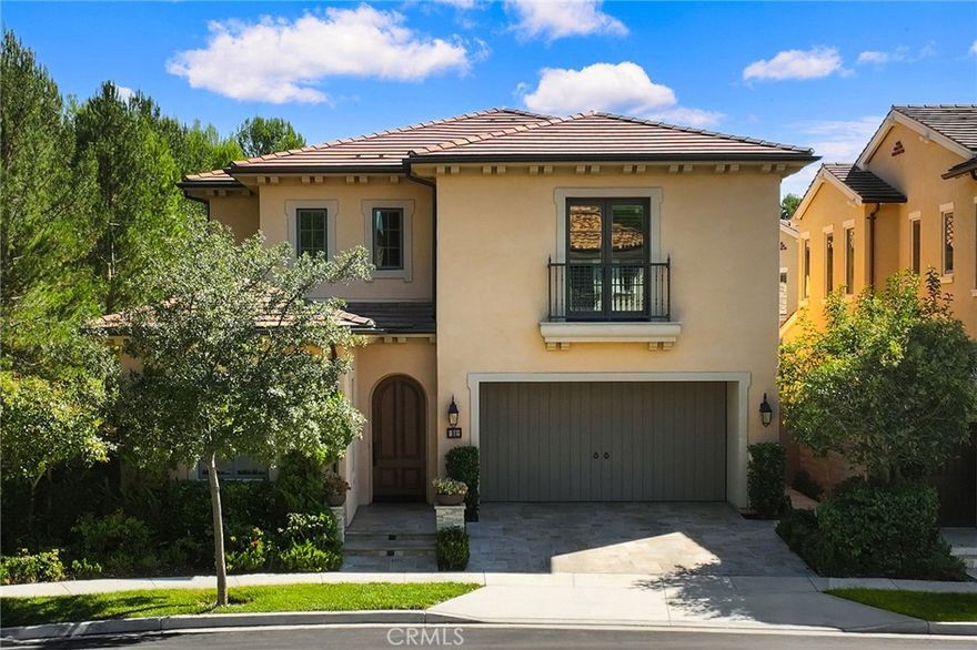 Welcome to 51 Thoroughbred, a stunning newer-construction end-unit home located on a private cul-de-sac in the desirable Strada community of Orchard Hills. This residence boasts soaring cathedral ceilings and an open floor plan, creating a bright and inviting living space. Expansive glass doors and windows open to a beautifully landscaped backyard featuring travertine flooring, a water feature, and a built-in BBQ island with seating—perfect for outdoor entertaining. The interior has been upgraded with brand-new flooring throughout, complementing the gourmet kitchen with custom tile backsplash, a large center island with seating, KitchenAid appliances, ceiling-height cabinetry, and a walk-in pantry. A convenient downstairs bedroom and full bath are ideal for guests or multi-generational living. Upstairs, a versatile loft offers space for a playroom, office, or media room. The serene primary suite includes a customized walk-in closet and spa-inspired bath with dual vanities, a soaking tub, and a separate shower. Two additional bedrooms, a full bath with double sinks, and a spacious laundry room complete the upper level. Additional highlights include a reverse-osmosis water filtration system, whole-house water softener, plantation shutters, automatic outdoor lighting and irrigation, and a garage with epoxy flooring and extensive built-in cabinetry. Residents of Orchard Hills enjoy resort-style amenities including pools, spas, BBQ areas, basketball courts, and playgrounds. Conveniently located near major freeways, toll roads, premier shopping and dining, and within the award-winning Irvine Unified School District including Northwood High School.