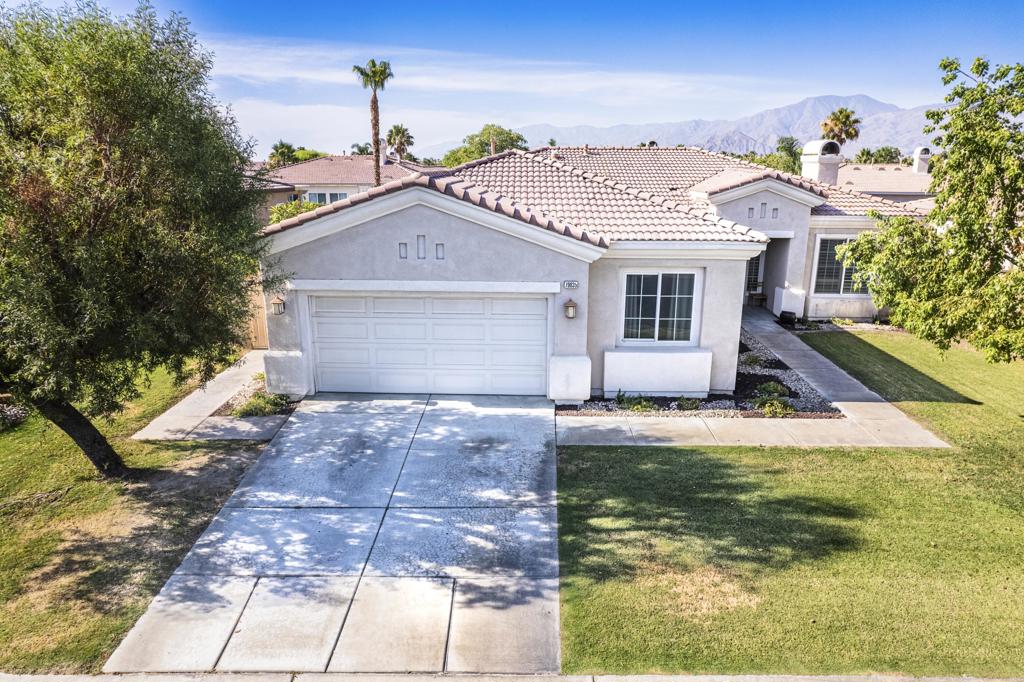 Behind the gates of Esplanade. This Beautiful 4-bedroom plus Den (5th bedroom) welcomes you to this inviting home with formal living & dining area that connects to the spacious family room with fireplace that is open to the with granite counter tops, skylight, island with bar seating & breakfast nook with built in desk. The good size master bedroom has sliding doors leading you to the backyard. The master suite has an over-sized walk-in closet the master bathroom has double vanities, soak in tub and shower. Second & Third bedrooms have shared guest bath with dual sinks. The fourth bedroom is another suite with its own bathroom. This home also features a spacious laundry room with ample storage, and sink, the garage features space for two cars. Additional skylights in the hallway making the house feel bright and open. Schools, parks, dining, and shopping are close by. This home is located in the Imperial Irrigation District for lower-cost electricity. Don't miss out on viewing this fabulous home in a well-situated Esplanade community.