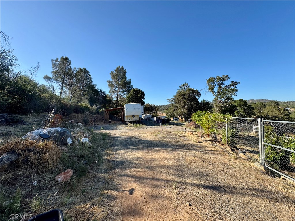 Welcome to 65 Torry Dr. in Oroville a remarkable opportunity to transform your vision into reality. Imagine constructing your dream home on this +/-13.42 acre parcel, with an ideal building site located at the west end of the property along with multiple other areas to consider. This is not just land; it’s your chance to create a sanctuary away from the hustle and bustle of daily life, where you can enjoy mother nature. Previously, a three-bedroom residence existed on this land which could potentially offset building fees, and now it awaits your imagination for design and personal vision. Conveniently situated just 18 minutes from the heart of Downtown Oroville and a mere 14 minutes to Bidwell Marina at Lake Oroville, this location balances country living with accessibility. Whether you’re looking for a weekend getaway or a permanent retreat, this parcel offers the space and flexibility to bring your dream home to life. Well and power exist with potential septic from prior home that stood here; condition unknown. Seller will leave the RV for someone looking to build their dream home offering a place to camp out while constructing. Don’t miss out on this rare opportunity. Seller may consider OWNER FINANCING this property with LARGE down; SUBMIT OFFER FOR SELLER CONSIDERATION.
