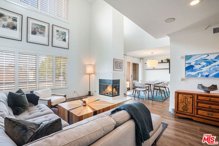Beautifully renovated, light-filled townhouse with designer finishes in an unbeatable Santa Monica location. Offering 3 bedrooms + a versatile loft/office with a large rooftop deck and 2.5 bathrooms, this residence - available furnished or unfurnished - combines comfort and style across multiple levels. The magazine-worthy, updated kitchen boasts custom cabinetry, a striking island, and high-end appliances. All three bedrooms are located on the main level, including a spacious primary suite with fireplace, spa-like ensuite bath with double vanities, and direct access to a private patio. Two additional bedrooms, each with their own patios, share a beautifully renovated guest bath. Upstairs, soaring ceilings and an elegant double-sided fireplace anchor the open living room, adjacent to a chic powder room and bright dining area with its own balcony. A loft space above is perfect for an office or guest room, leading to the expansive rooftop deck - ideal for entertaining or relaxing. Additional highlights include side-by-side parking in a gated garage, modern upgrades throughout, and a boutique 4-unit building that is exceptionally well maintained. Located in the sought-after Franklin School District, just one block from Erewhon and minutes to Montana Avenue, shopping, dining, and the beach.