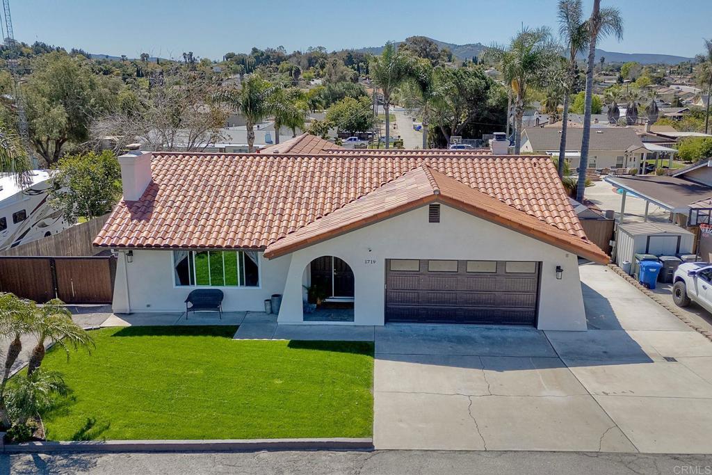 Spacious, Upgraded Home with Room to Relax, Host & Play! Pride of ownership shines in this beautifully updated home on a fully landscaped ½-acre lot. Located on the Escondido/San Marcos border, this property offers the perfect blend of space, convenience, and easy access to nearby amenities and commuting routes. Enjoy an expansive layout featuring an upgraded kitchen with granite counters, stainless steel appliances, and modern finishes throughout—including new flooring, paint, stucco, lighting, and more. This spacious home offers 2 interior fireplaces, solar tubes for added natural light, ceiling fans, and a generous living and family room. Step outside to your entertainer’s dream backyard with a sparkling pool and spa, built-in outdoor kitchen, fire pit, outdoor fireplace, and a full outdoor bathroom—perfect for poolside gatherings. With a lot this size, there’s ample space and access to build an ADU (Accessory Dwelling Unit) for guests, multigenerational living, or rental income (buyer to verify). Additional highlights include RV parking with hookups, space for boat/large vehicle storage, a huge storage shed, and an attached 2-car garage. Move-in ready and loaded with upgrades—this is a must-see!