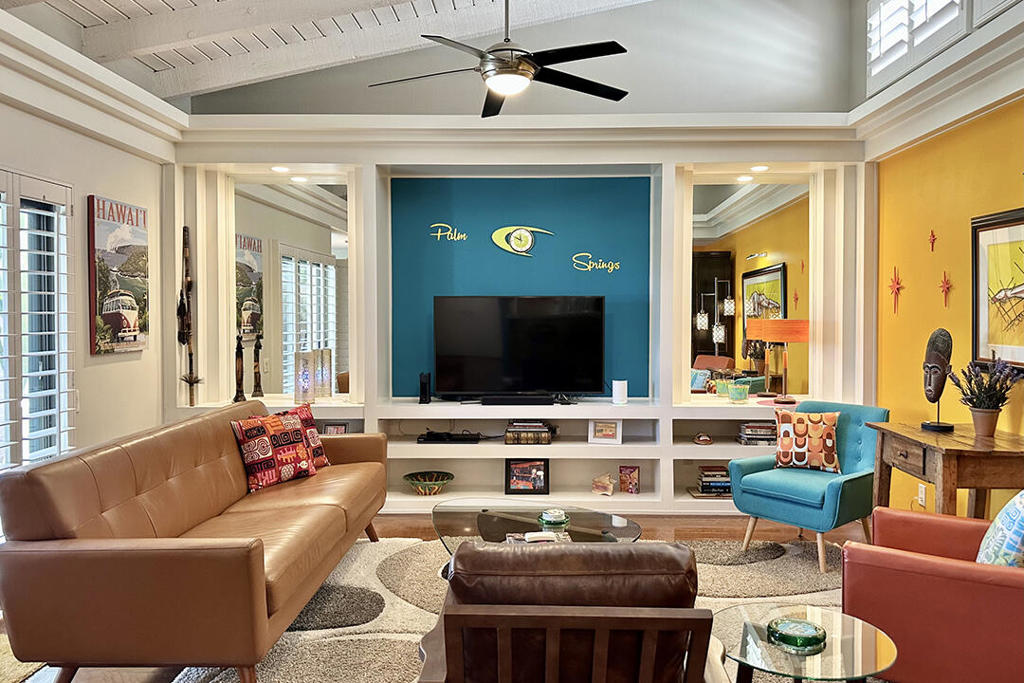 This two-bedroom South Palm Springs condo is a serene retreat with an unbeatable location. An upstairs unit, it is spacious and private, featuring vaulted wood-beam ceilings and clerestory windows that fill the home with natural light, a gorgeous kitchen, and three patios. Stylishly updated and meticulously maintained, this home showcases designer touches like custom built-ins, plantation shutters, beautiful finishes, and a seamless indoor/outdoor flow.Sliding glass doors from both the living room and dining area open to a large balcony, which is perfect for entertaining. The bedrooms also each have a private outdoor space, both of which overlook a central courtyard with community pool and spa, framed by a stunning mountain backdrop. Each bedroom also has an ensuite bathroom.Additional conveniences include an in-unit washer/dryer, a suite of newer stainless steel kitchen appliances, engineered hardwood flooring, and plush bedroom carpeting, as well as a dedicated storage closet, assigned carport, and newer HVAC and water heater. In addition, the Versailles is a vibrant condo community with an active and well-run HOA. Its convenient location across from the Smoke Tree shopping area provides unmatched convenience with grocery shopping, restaurants, coffee, and retail options. This is desert living at its finest.Additional Amenities include: HVAC system and hot water heater installed in 2021 Newer kitchen appliances: Fisher and Paykel dishwasher and LG microwave replaced five years ago. The refrigerator and Oven/stove are 10 years old. Washer and dryer are also 10 years old Two (2) well maintained and updated community tennis courts with lighting Four (4) community pools and four (4) spas: recently refurbished + new decking + newer pool furniture HOA also provides security with security cameras at all pools and carports. A security company walks the property every night Smart thermostat Furnishings are available outside of escrow per inventory