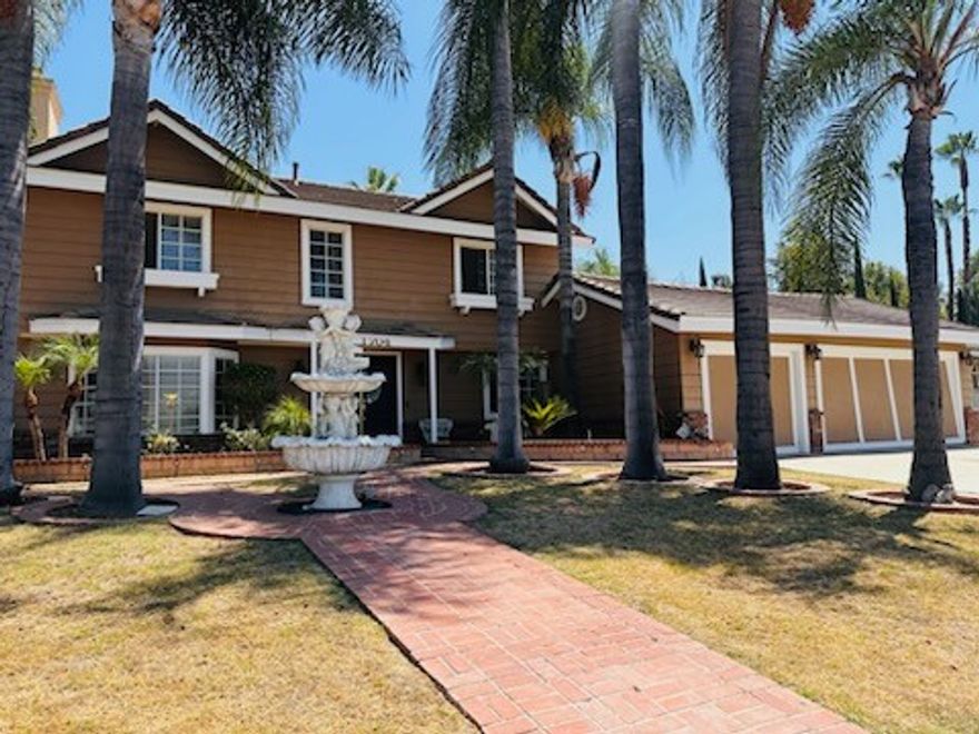 Beautiful Home Located nice area of West Covina 4 bedrooms 3 baths, new roof, 3 car garage and laundry area.  This beautiful home was just remodeled a few years ago, beautiful custom kitchen cabinets, granite countertops, living room with fireplace, dining room extra larch family room enough for all your gathering and entertainment, recessed lighting, crown molding, baseboards, great bonus bar/game room, master bedroom with fireplace, porcelain title floor and hardwood floors in the fist flor, huge backyard, covered wood patio, BBQ Island with patio, don't miss this beauty.