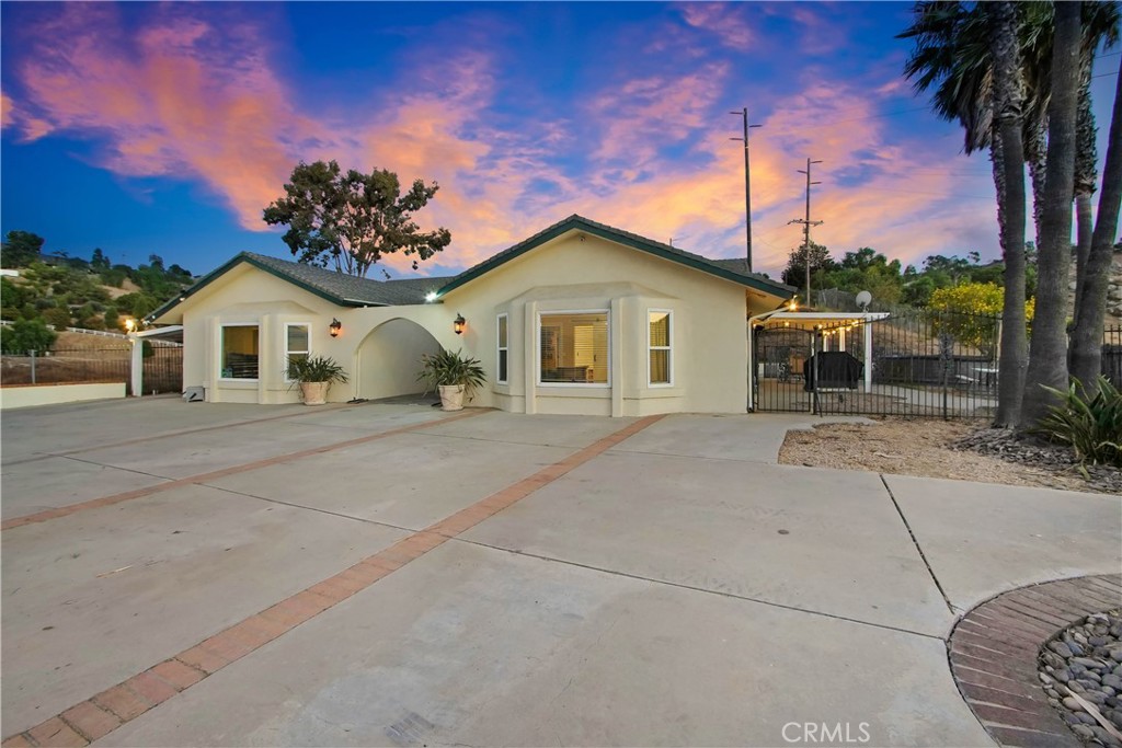 Beautiful Breathtaking Sunset Views, Priced to sell!
Escape to peaceful living in this beautiful open-floor plan home, nestled in the Spring Hills Community Neighborhood. With breathtaking sunset views and gorgeous panoramas from every angle of the property, your search ends here!
This single-story gem is situated on almost 4 acres of combined land from four lots, all included in one sale. Located atop a hill and at the end of a quiet street, you'll be surrounded by captivating views and nature, with hiking trails just a short walk away.
This remodeled home boasts 4 bedrooms and 2 bathrooms, plus a versatile bonus room or studio. Previously used as a gym and now a mini studio, this space features its own private entry and can easily be converted into a granny flat with an added bathroom or transformed into your private "man cave." This all-electric home is equipped with 21 solar panels, significantly reducing your electricity bills. It's truly move-in ready and an ideal place to entertain and savor the sunset from multiple vantage points, country living within the city.
The current homeowner is sad to leave, but a work relocation necessitates the move. This property is priced to sell, with a VA assumable loan available for any veteran.
For those with a passion for the outdoors, this property offers ample space for horses and farm animals—just build your corrals and bring them over. Theres also plenty of room for all your off-roading toys, with space to grow and expand. The main lot features a large flat area at the top, ready for your imagination to run wild. Additionally, the lower end of the property fencing includes a separate lot number with potential for building another house (buyers are encouraged to investigate building and permit requirements). A water storage tank is on-site for irrigation, and the two main lots are fully fenced, ensuring privacy and keeping wild donkeys out. With one of the lots offering 1.20 acres and its own APN, consider the potential to build another house.Don't miss out on the incredible potential this unique listing offers!
**Key Features:**
**Convenient Location:** A short drive to Box Springs Mountain Reserve Park, the 60 and 215 freeways, schools, church, restaurants, and shopping.
**Exceptional Value:** Four lots for the price of one, providing almost four acres of land.
**Must-See Views:** The sunset views are truly breathtaking, stunning, and impressive, a must see around 7:30 pm evening time.