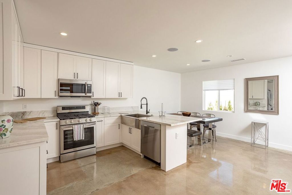 A gorgeous home recently renovated with lots of attention to detail and prime location. A Must see with a very inviting entrance, boasting an open concept and a great layout. This home features 3 bedrooms, 2 baths, about 1,200 sqft, with a spacious front side-yard. Everything in this home is completely updated and beautifully remodeled, including showroom-like recessed lighting throughout, surround system, new dual-panel windows, new electrical, copper plumbing, new roof, new hardscaping, fencing, and recently painted outside/inside. Modern kitchen with stainless steel appliances, and stone countertops with an island open to the living room. Both of the bathrooms have been completely remodeled, with very elegant finishes and light fixtures. The Property is a duplex, separated from the front Home, and it has its own private yard and driveway entrance.