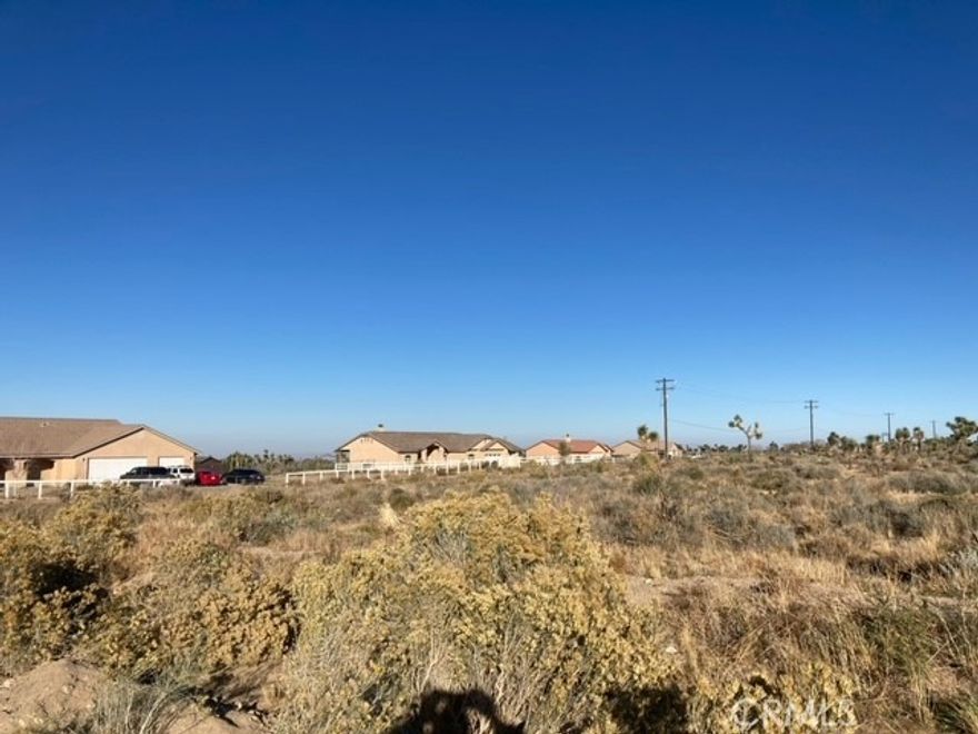 Flat lot close to town. Walking distance to library and post office. Beautiful mountain views. Owner has 3 more lots can do a package deal for all 4.