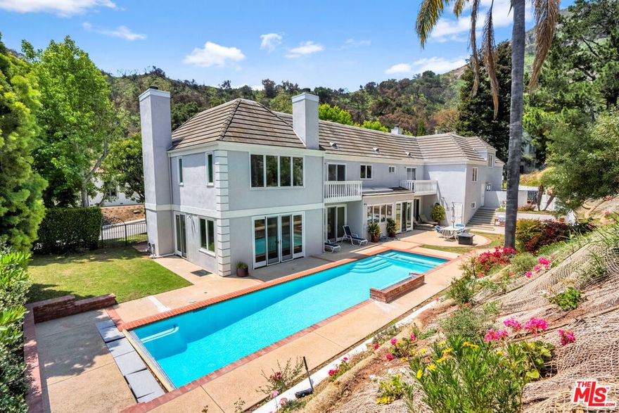Tremendous opportunity. The largest home in Pacific Palisades on the market for under $3.5 Million. Situated on a quiet cul-de-sac in the highly desirable 24-hr guard-gated Palisades Country Estates, this spacious home has a private pool, spa, outdoor bbq and grassy yard.  The upstairs has 5 bedrooms, while there is a 6th bedroom on a separate level. The main floor of this stately residence offers a family room with brick surround fireplace and bar, large living room with stunning fireplace mantle and surround, a modern kitchen with eat-in breakfast area and formal dining room. Finally, the loft would make a great game-room, office or play area. The motor-court with 3-car garage provides plenty of off-street parking.  Your chance to move in to a 6- bedroom home rarely available in this price category.  No houses on the street were lost to the fire and residents have been back enjoying their homes in this sought after community. Furniture is available if Buyer is interested. Property is also available for furnished or unfurnished lease for $17,500 per month.