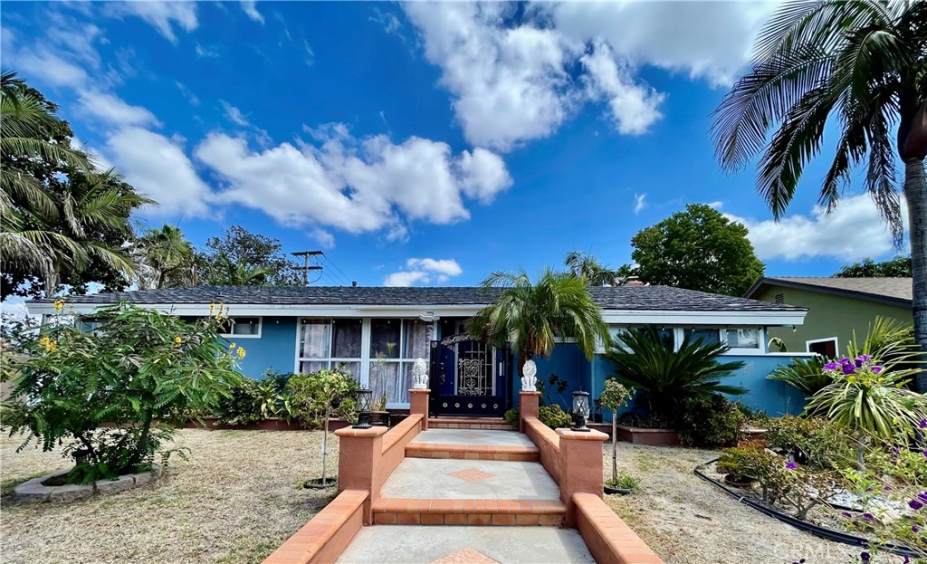 This charming 3 bed and 2 bath home is located on a large corner lot with an alley and a detached 2 car garage. Step inside to an open living space featuring a formal dining room that flows into the kitchen, creating a warm and inviting atmosphere. Recently remodeled kitchen features royal blue soft-closing cabinets, stainless steel appliances, a large sink, and quartz counters. Upgraded bathrooms and floor. Family room with fireplace for gathering family connecting to a spacious backyard to enjoy the Disneyland fireworks. Amazing opportunity to build an additional dwelling unit (ADU). Across of Stoddard Elementary School, walkable to Stoddard Park, Disneyland, Downtown Disney, easy access to freeways, supermarkets, restaurants, public transportation.