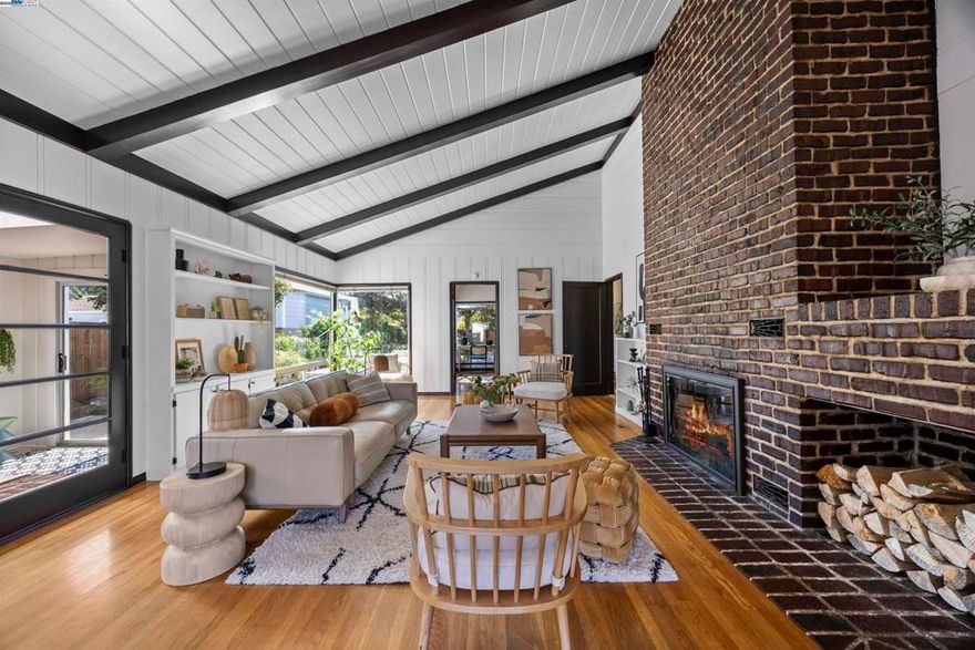 Mid-century modern meets bespoke charm! This single-level Warren Manor home offers seamless indoor-outdoor living, with a spacious backyard featuring a deck and manicured gardens, perfect for entertaining or simply unwinding. Inside, a rich fireplace and a beamed vaulted ceiling capture the warmth of a cabin getaway. Oversized windows showcase an open, airy atmosphere, with plenty of natural light filling the living areas. French doors invite you into a captivating sunroom with outlooks to the gardens and side yard access, offering bonus uses as a den, office or expanded living space. Practical and updated with whole home repiping, new furnace and complete reducting, Owens Corning attic insulation, Titan security door and LifeScape fencing, your new home includes a large two-car attached garage with ample storage. Shop at Trader Joes, retreat at Lake Chabot and be minutes to downtown Castro Valley and Hayward, 2 farmers markets and both BART stations!