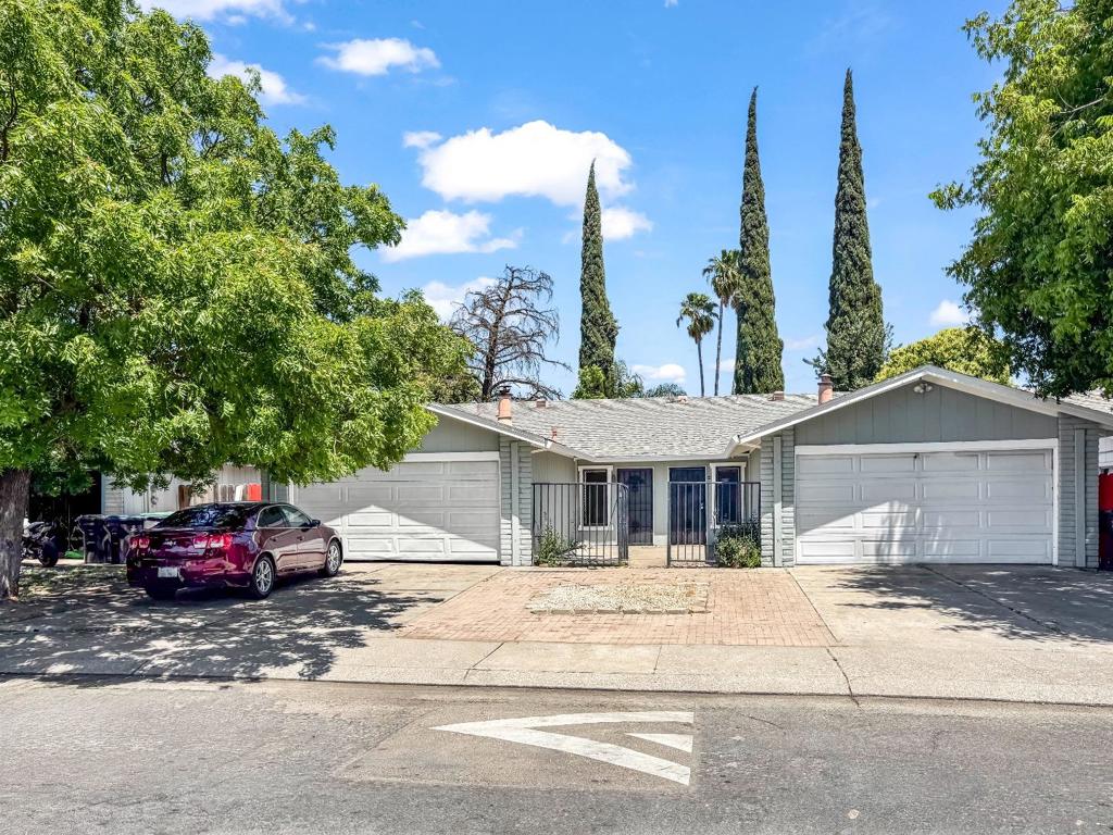 Live in a spacious 3bed/2 bath home with convenience of 2 car garage, while enjoying supplemental income from stable, long-term tenants. Both units have been thoughtfully updated, featuring newer A/C systems, new laminate flooring, new paint inside and outside, a new garage door, water heater, and upgraded copper plumbing in one unit. Move-in-ready and perfect for owner occupied or investors. Take pride in ownership with this well-maintained property - plus, the long-term tenant would love to stay!