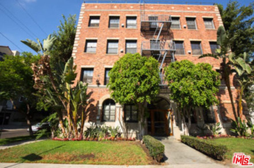 Beautiful single apartment with exposed brick. This is a must see! The unit comes with hardwood floors, full kitchen, office or small room for bed and a full bathroom. Partial view of the Hollywood Hills. Two closets offer plenty of storage. Located on a beautiful treelined street between Wilshire and 3rd. Walk to cafes, coffee shops and the Grove. Parking is off street and permitted through the city. Building is secure with code for entry. Pictures are of a like unit.