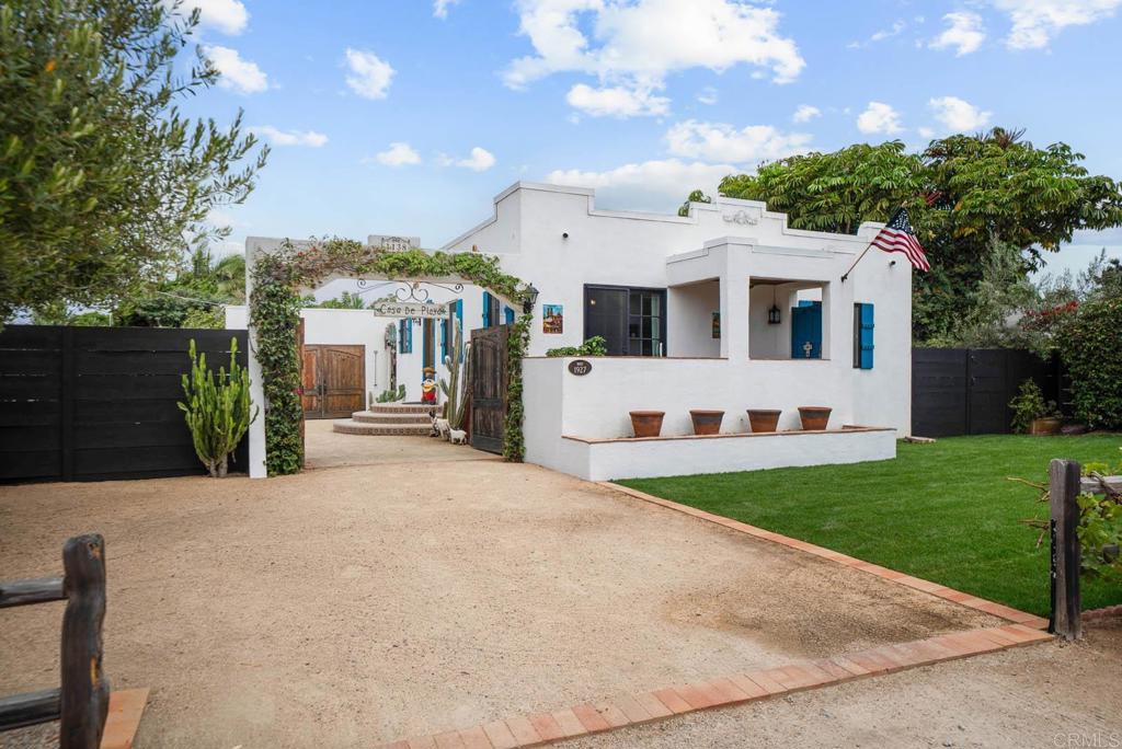 Step back in time and into the romance of Old Mexico and early California with this 98- year-old colonial Spanish bungalow, gracefully set on nearly a quarter- acre, this rare retreat offers both space as well as seclusion, in the highly sought-after Carlsbad Village. Behind the gated entrance, a welcoming courtyard evokes the charm of a mini hacienda- a serene space for morning coffee, intimate gatherings, or simply basking in the coastal breeze. This distinctive, light-filled retreat offers an airy open floor plan with an abundance of fresh air and ocean breezes. This home's timeless architecture blends warmth and history, offering authentic character rarely found today. A unique and beautiful feature is a hidden speakeasy-style cellar adds a whisper of whimsey and character, ideal for wine, storage or creative flex space. The lush grounds are a true gardener's and gourmet's dream, boasting 6 varieties of avocado trees along with lemon, orange, tangerine, loquat, pomegranate and olive trees. Whether you envision preserving its vintage soul or enhancing it with modern touches, this unique property offers a rare opportunity to own a piece of Carlsbad's living history, all within strolling distance of the village's lively cafe's, boutiques, coaster, and the beautiful beaches. Must see this hidden gem to fully appreciate.