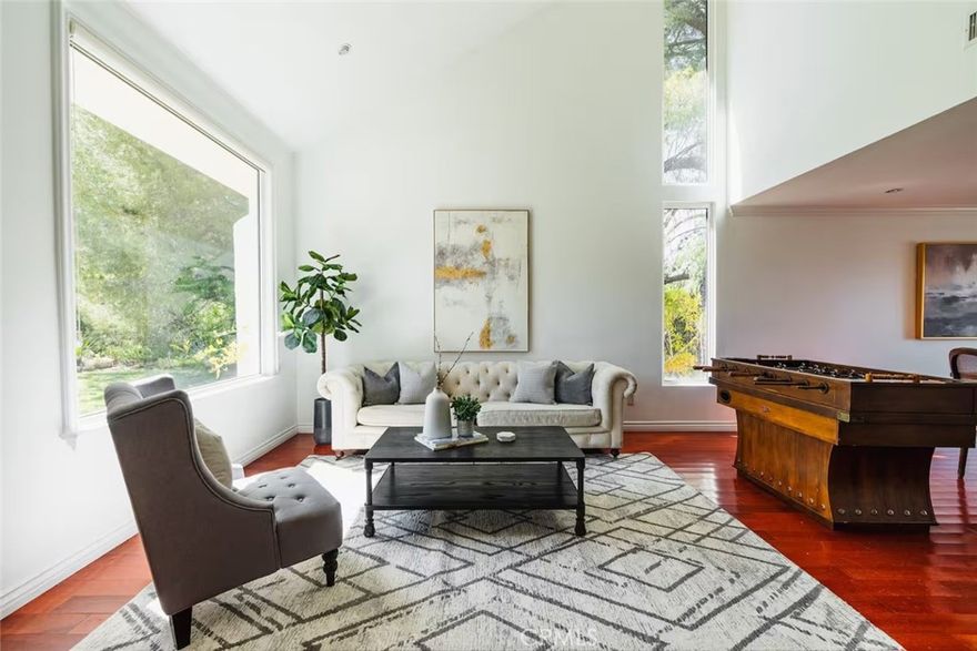 Stunning Furnished View Home in Woodland Hills – Available for Long or Short-Term Lease! This beautifully furnished 3-bedroom, 3.5-bathroom residence in the hills of Woodland Hills offers sweeping panoramic views, luxurious finishes, and a thoughtfully designed layout perfect for comfortable living and entertaining. Step inside to a dramatic two-story living room that flows effortlessly into the formal dining area and expansive family room. The gourmet kitchen is a chef’s dream, featuring ample counter space, sleek cabinetry, and top-of-the-line Viking stainless steel appliances—including a 6-burner range, hood, wine fridge, and more. A convenient half bath is located on the main level for guests. Upstairs, the spacious primary suite is a true retreat, boasting stunning views, a private office nook, and a spa-inspired en-suite bath with a soaking tub, separate shower, and a large walk-in closet. Two additional generously sized bedrooms each offer their own private bathrooms and breathtaking views. The upstairs laundry room is both functional and stylish, equipped with a front-load washer and dryer, a deep sink, and ample counter space for folding and storage. Outside, enjoy California living at its finest with a fenced saltwater pool perfectly positioned to take full advantage of the incredible vistas—ideal for relaxing or entertaining. The property also includes garage and driveway parking for added convenience. Located in a quiet hillside neighborhood yet just minutes from shops, dining, hiking trails, and top-rated schools, this home offers the perfect balance of serenity and accessibility. Minutes away from Malibu and Calabasas. Don’t miss the opportunity to lease this exceptional home—whether you're looking for a long-term stay or a short-term getaway, this one has it all.