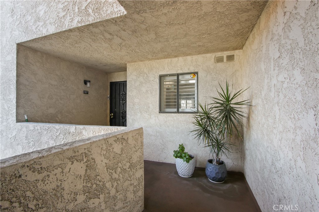 Discover this beautifully maintained 3-bedroom,2 bath end-unit condo nestled in a peaceful, amenity-rich community. This home features a spacious primary suite with walk-in closet, a glass-enclosed shower, and a private patio access. The modern kitchen is adorned with elegant cabinetry, tile flooring, and optional new stainless-steel appliances. Enjoy seamless indoor-outdoor living with one of the largest balconies off the living room, and scenic views of the nearby park and fishing lake. The home includes laminate flooring throughout, tile in the bathrooms and kitchen, a full-size washer and dryer in the hallway laundry closet, and a 2-car detached garage. The community offers two sparkling swimming pools and a quiet, well-kept atmosphere-perfect for relaxing or entertaining. This is an excellent opportunity to own a stylish and comfortable home in a highly desirable location. Don't miss your chance to own this inviting and move-in-ready home!