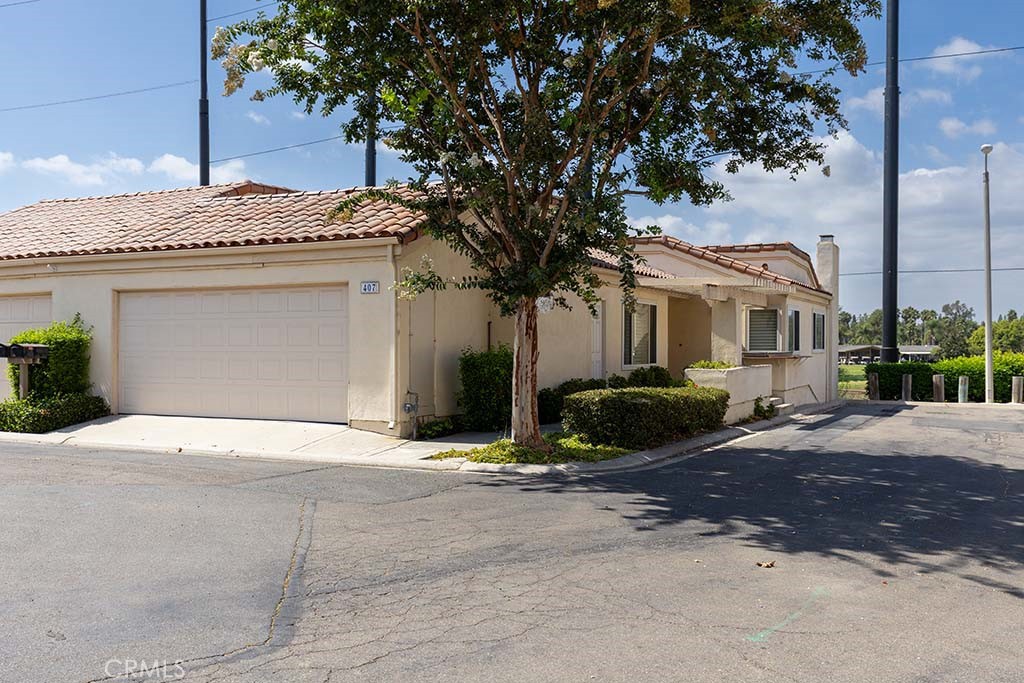 Highly sought after model in Fairway Village! End unit with 3 bedrooms 2 bathrooms with approximately 1572 sq ft. Updated kitchen with stainless appliances granite counters and stone flooring. Other features include, double door formal entry, Cathedral ceilings, ceiling fans, and built in cabinet in guest room. The Primary bedroom is located on the lower level with ensuite bath, with dual sinks, walk in closet and and large walk in shower with a private balcony. There is new carpet in the bedrooms and fireplace in living room with sliding door to the large balcony. Convenient 2 car attached garage and plenty of guest parking. This secure community has a 24 hour guard at the gate, and many HOA amenities to include pool, spa, clubhouse, pickle ball ,tennis courts, and meandering greenbelts. Located close to St Jude Hospital and the vibrant life of Downtown Fullerton. Won't last!