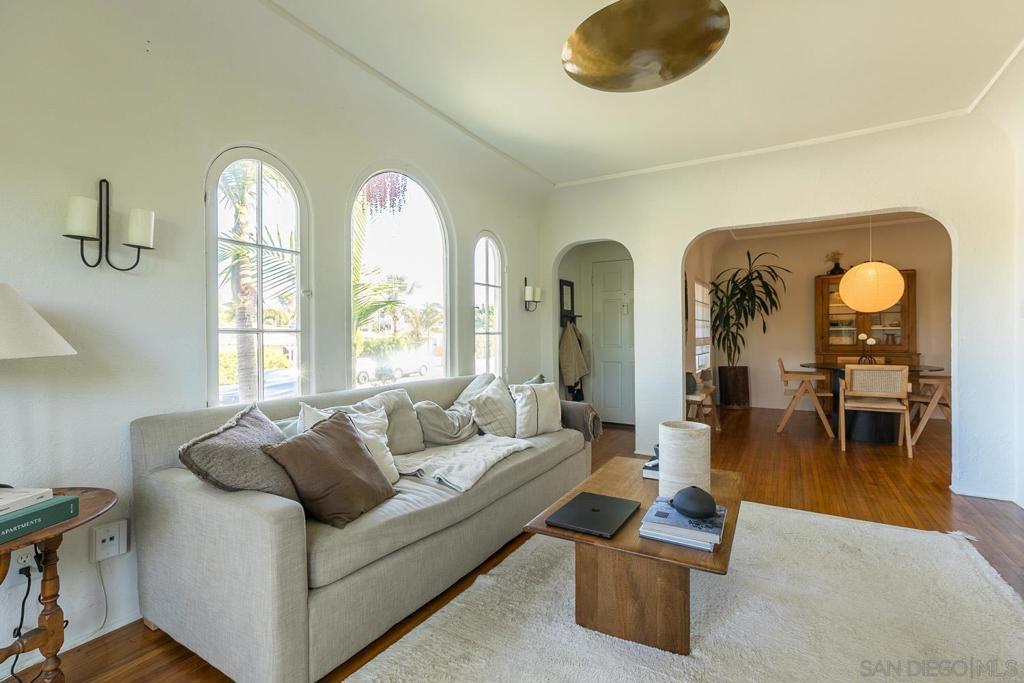 Charming Point Loma duplex with detached garage on an expansive 8,342 sq. ft. flat lot with three points of egress and excellent ADU potential, potentially supporting additional footprints of ~1,300 sq. ft. and 550+ sq. ft. (with two-story option) without affecting the existing structure. The two 2BR/1BA units feature 1920s Spanish character with arched doorways, original hardwood floors, and abundant natural light, paired with modern upgrades including a new roof (2020), updated systems, and a detached, refinished garage offering versatile use potential. Each unit also enjoys a private yard, while the property’s prime Point Loma location outside the Coastal Overlay delivers both immediate rental income and a rare opportunity to expand density while preserving historic charm.