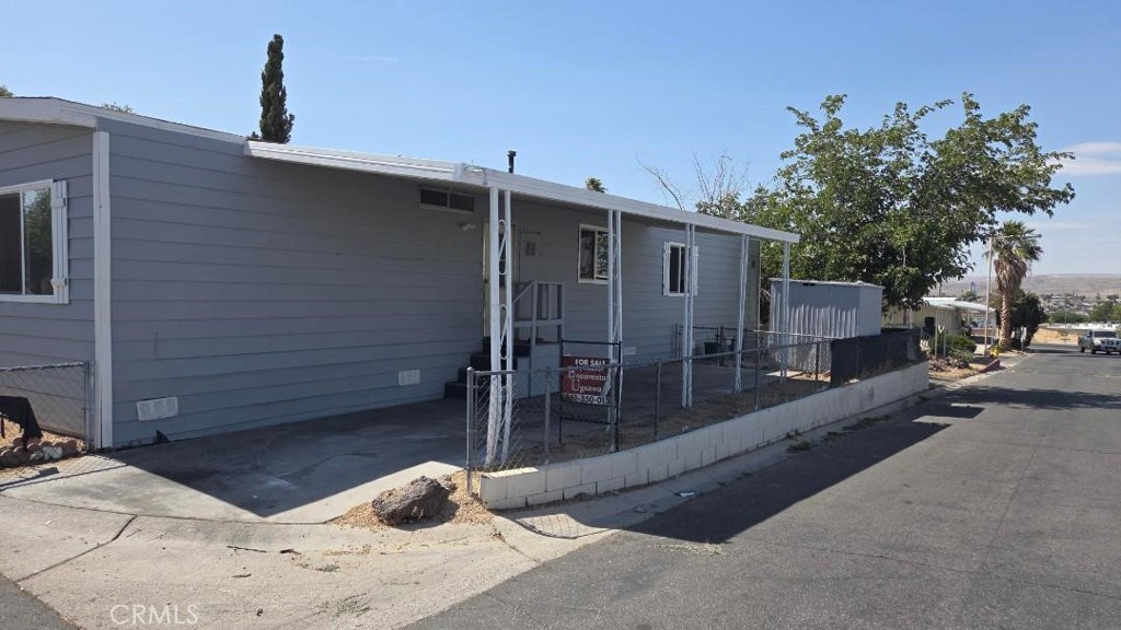 This cute 3 bedroom / 2 bath offers a laundry area, living room, and breakfast bar in the kitchen. You have space to add the 4th room bed. The washer, dryer hookup, and refrigerator and Stove will be staying. The park offers many amenities like Pool and Parking Ports. It's close to the freeway and only minutes from the center of Lancaster. The park is very well maintained.