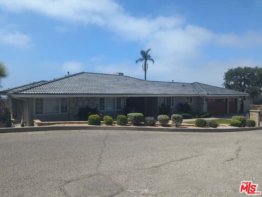 This beautifully rehabbed home, freshly painted throughout, is filled with natural light from the huge sliding doors opening into a private garden and pool with stunning ocean and mountain views. The gourmet kitchen is equipped with designer cabinetry, granite countertops, stainless steel appliances including refrigerator, cooktop, range-hood, double wall ovens, and dishwasher, along with a charming breakfast nook and a custom-made temperature-controlled wine cellar for up to 700 bottles. Living room and dining room share a floor-to-ceiling deco-stone dual fireplace. Bathrooms and bedrooms feature designer closets and custom cabinetry, with recessed lighting all throughout the home adding a warm and modern touch. Master bedroom features floor-to-ceiling glass panels soaking the room in abundant natural light and air, and two separate closets. Master bathroom comes with floor heater, dual sink vanity, separate bathtub, and large standing shower. Soak in the oversized bathtub while enjoying the ocean view. Kitchen leads to laundry room with super efficient machines, and direct access to the 3-car garage. Designer bamboo wood flooring throughout the house, except in the bathrooms, kitchen, laundry, and garage. Backyard is ideal for entertaining with custom-built outdoor grill, heated pool, all while simultaneously admiring the beautiful ocean, mountains, sunset, and everything that makes Pacific Palisades the envy of the rest of the United States! Just minutes to iconic biking & hiking trails, the famous Palisades Village, excellent restaurants, shopping, and top-rated schools.