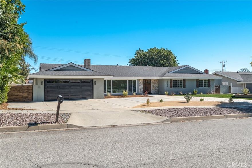 Nestled on a sprawling 15,000+ sq ft lot with breathtaking views of Mount San Antonio, this beautifully designed ranch offers indoor-outdoor living at its finest. The expansive yard features a sparkling pool, a court for recreation, alley access with a double-wide gate for possible RV parking, and plenty of room for entertaining.



Inside, earth-toned finishes and warm tans create a nature-inspired palette throughout. The oversized kitchen is a chef’s delight with white oak shaker cabinets, elegant quartz countertops with subtle color veining, and a perfectly sized island ideal for gathering. New LVP flooring and recessed lighting flow through the home, enhancing brightness and a modern feel.



Four spacious bedrooms are thoughtfully placed off the main living areas for added privacy. The primary suite includes a dual-sink vanity and a walk-in shower. Practical conveniences include an interior laundry room.



A rare combination of generous outdoor space, thoughtful design, and panoramic mountain views — perfect for families, entertainers, and anyone seeking comfortable, single-level living in North Upland.